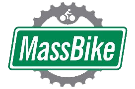 a green and white sign with a grey gear and a bicycle
