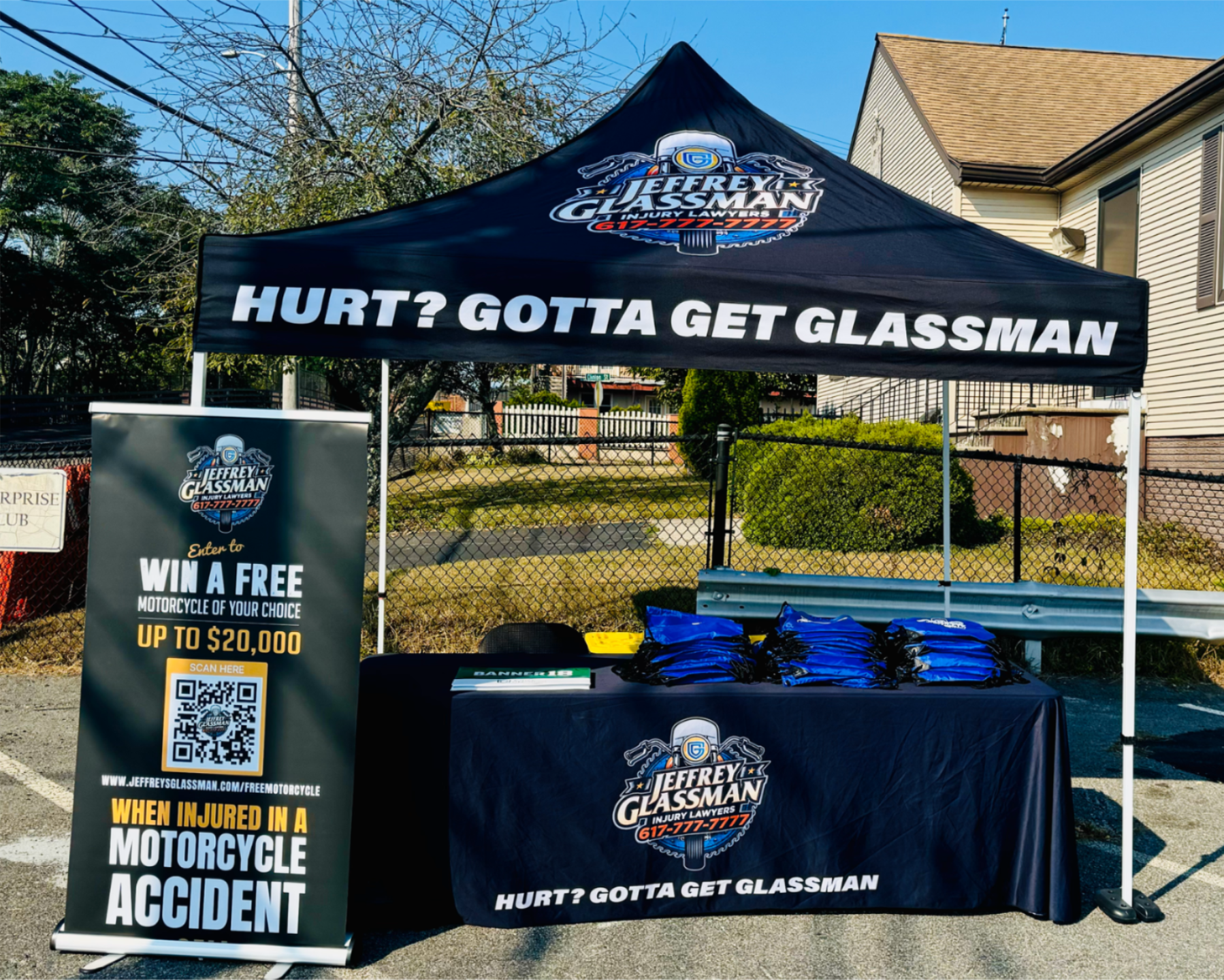 a tent with a table and a sign