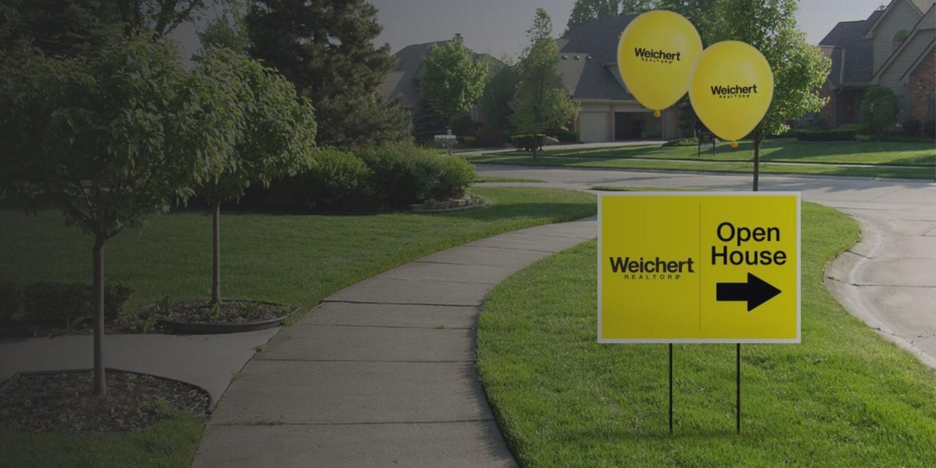 Yard with Weichert open house signs