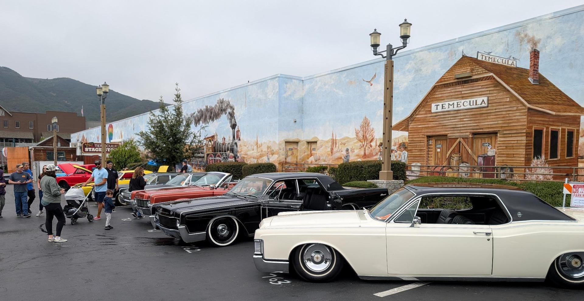 Classic cars lined up near the Old Town Temecula mural during the Rod Run