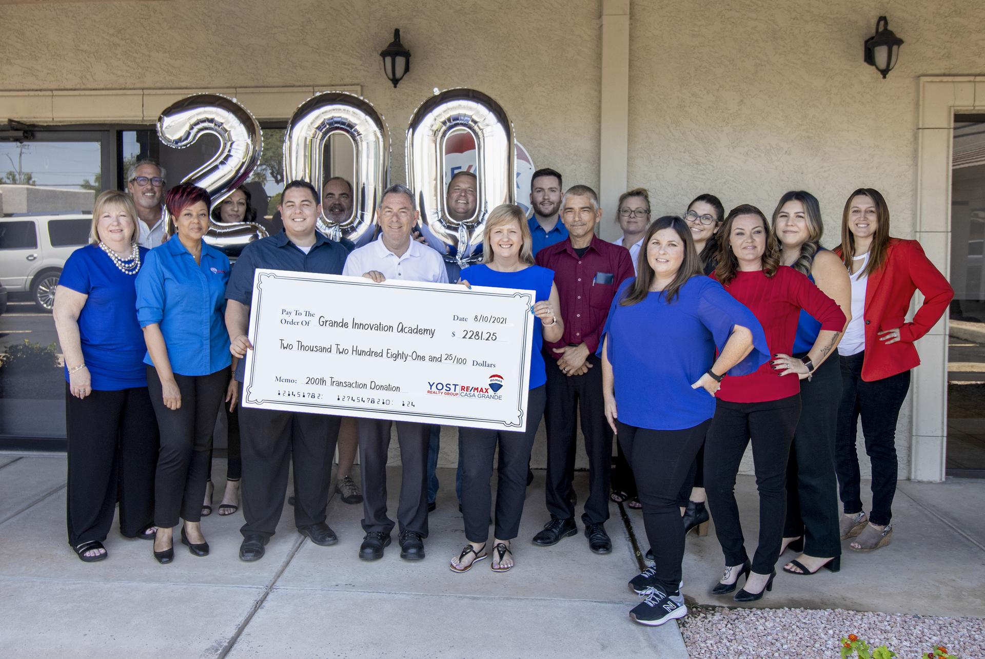 The Yost Realty Group team celebrating a closing milestone
