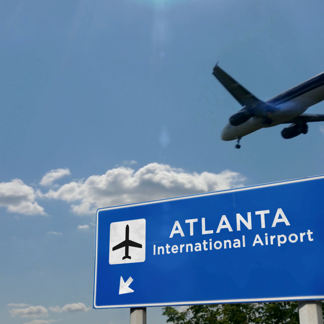 Atlanta International Airport sign and airplane representing convenient travel access from McDonough Georgia Atlanta International Airport sign and airplane representing convenient travel access from McDonough Georgia