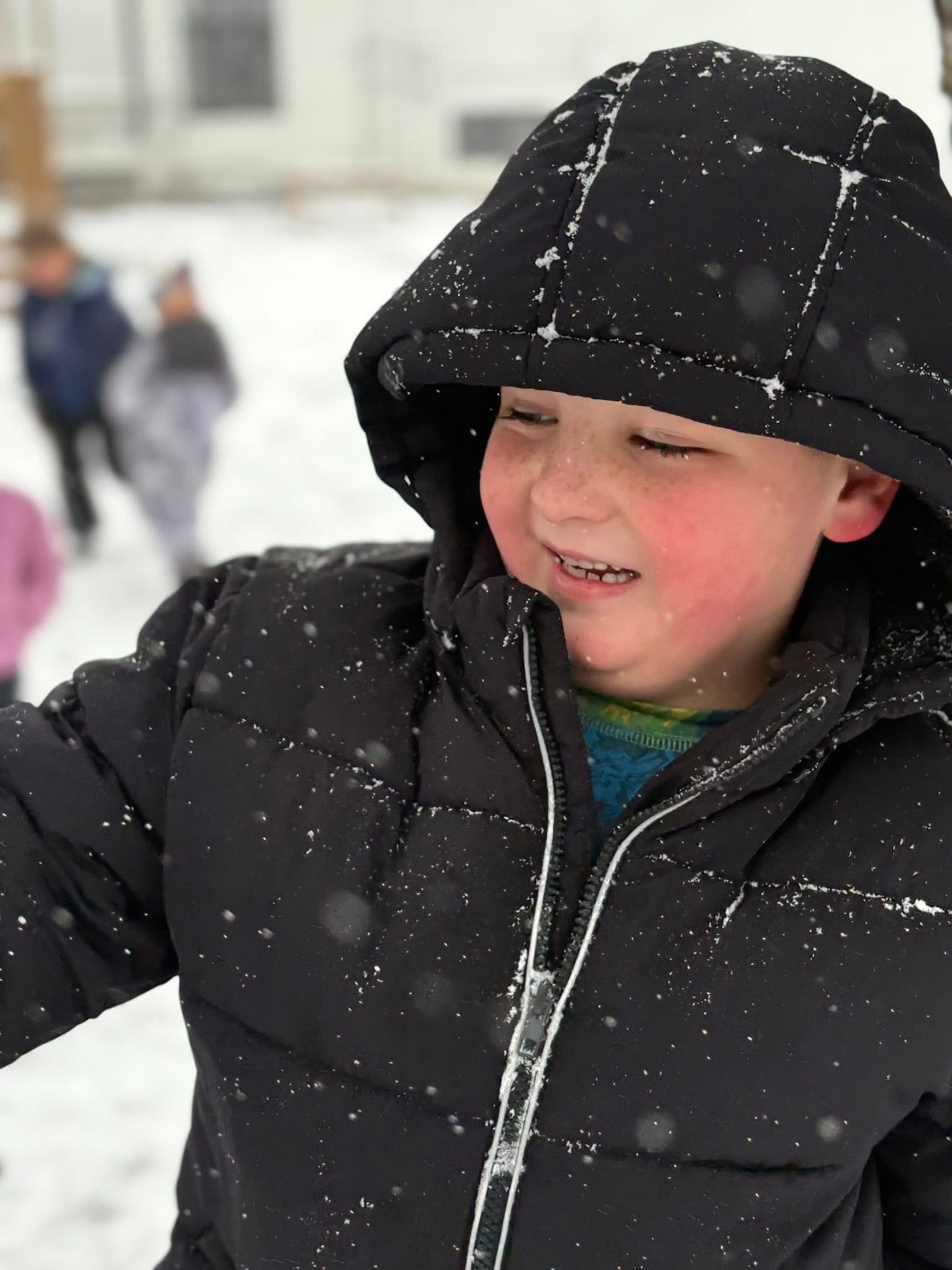 Cass County child playing in the snow on a winter day