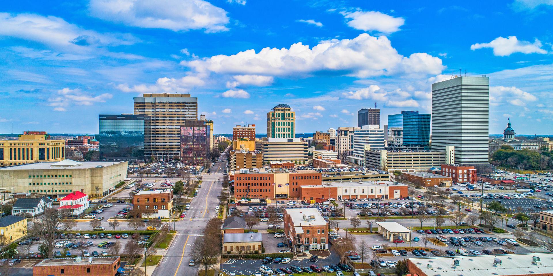 Skyline view of downtown Columbia, SC near the Congaree River, perfect for families and professionals relocating to South Carolina.