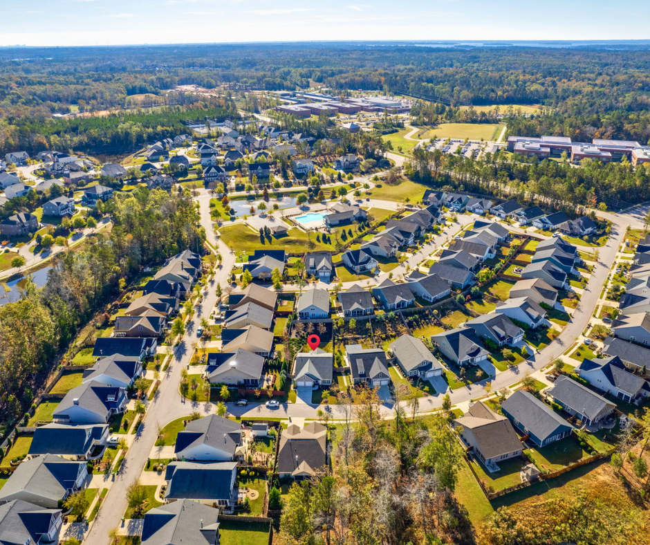 Aerial view of Portrait Hill neighborhood in Chapin, SC featuring tree-lined streets, modern homes, and community amenities near Lake Murray. - realtorlakemurraysc.com