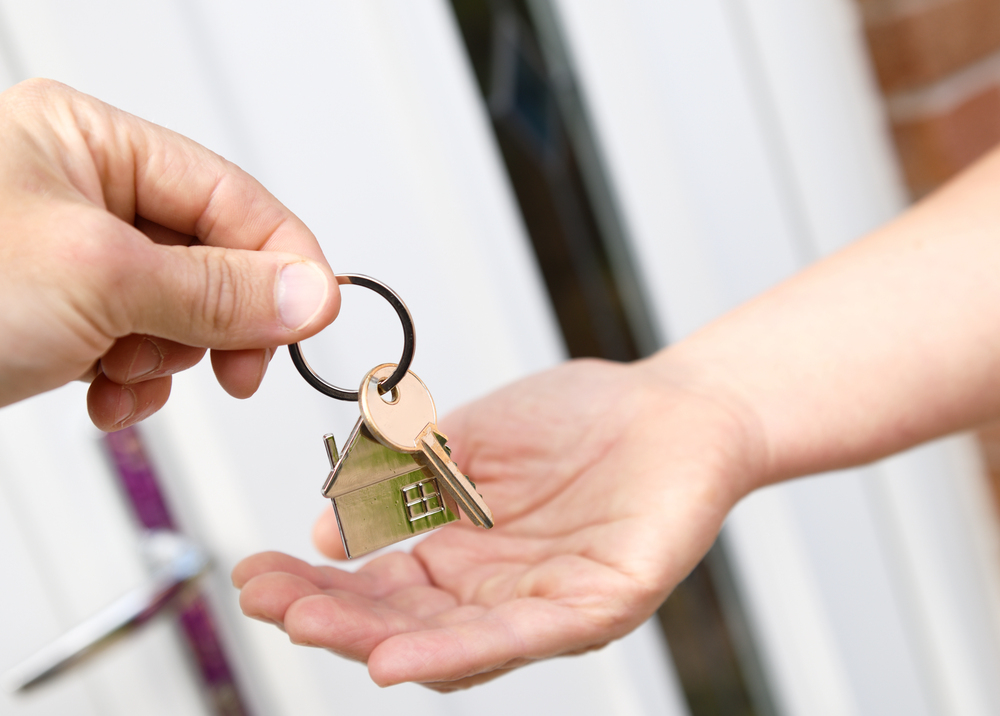 house keychain and key in door knob