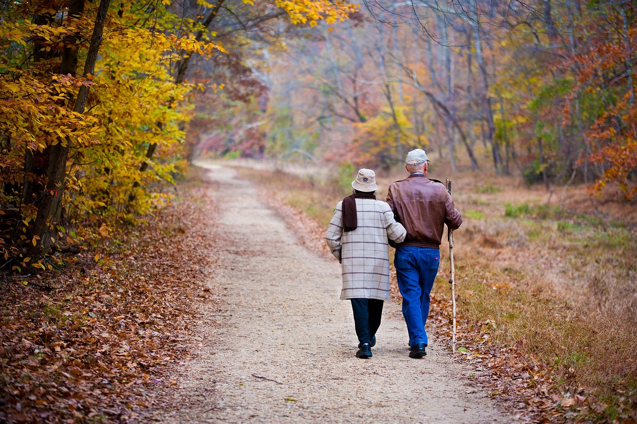 Older couple walking in fall