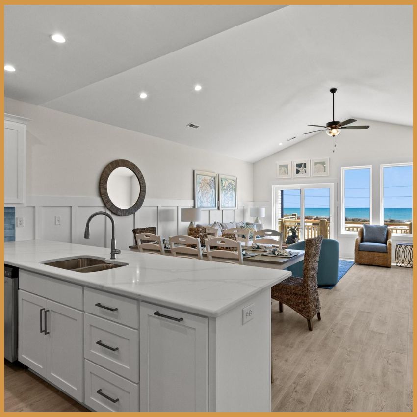 view of kitchen, dinning, and living room with ocean views view of kitchen, dinning, and living room with ocean views