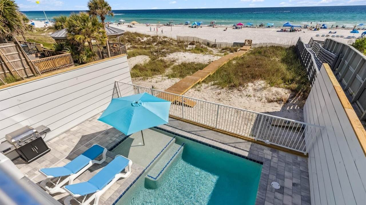 small backyard with a pool on the beach of a panama city beach home