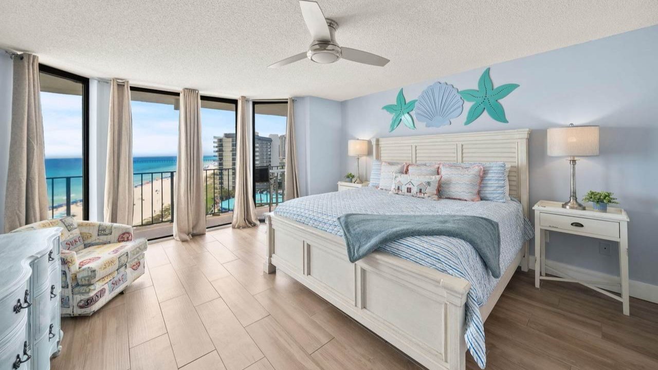 luxurious bedroom of an edgewater home with the beach right outside