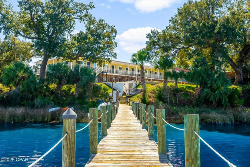 image of a secluded cove home hidden in the trees from the end of a dock image of a secluded cove home hidden in the trees from the end of a dock