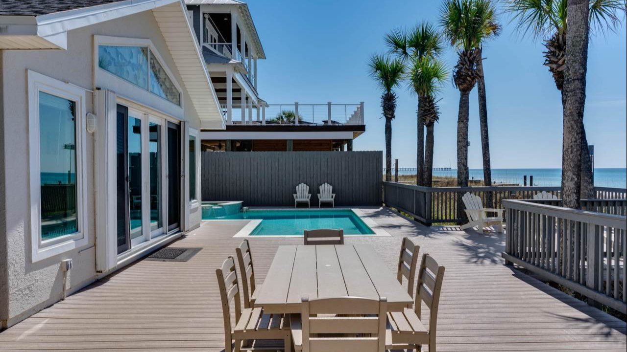 a modern day home with a small "L" shaped pool near the panama city beach condos a modern day home with a small "L" shaped pool near the panama city beach condos