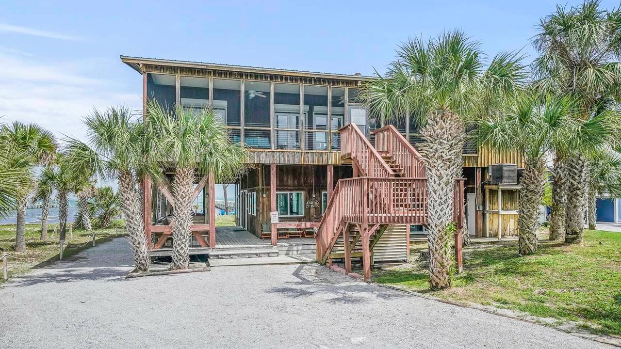 unique port st. joe home with a full glass window front