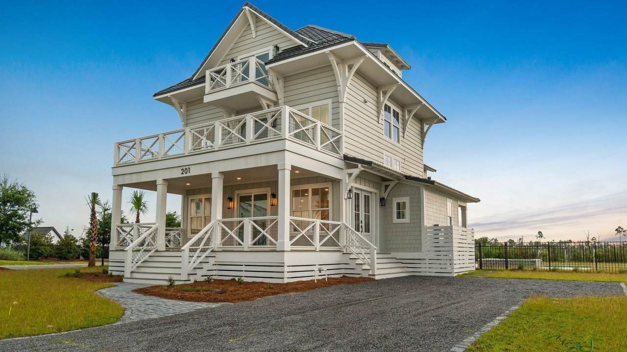 mexico beach home with a small staircase leading to its front door