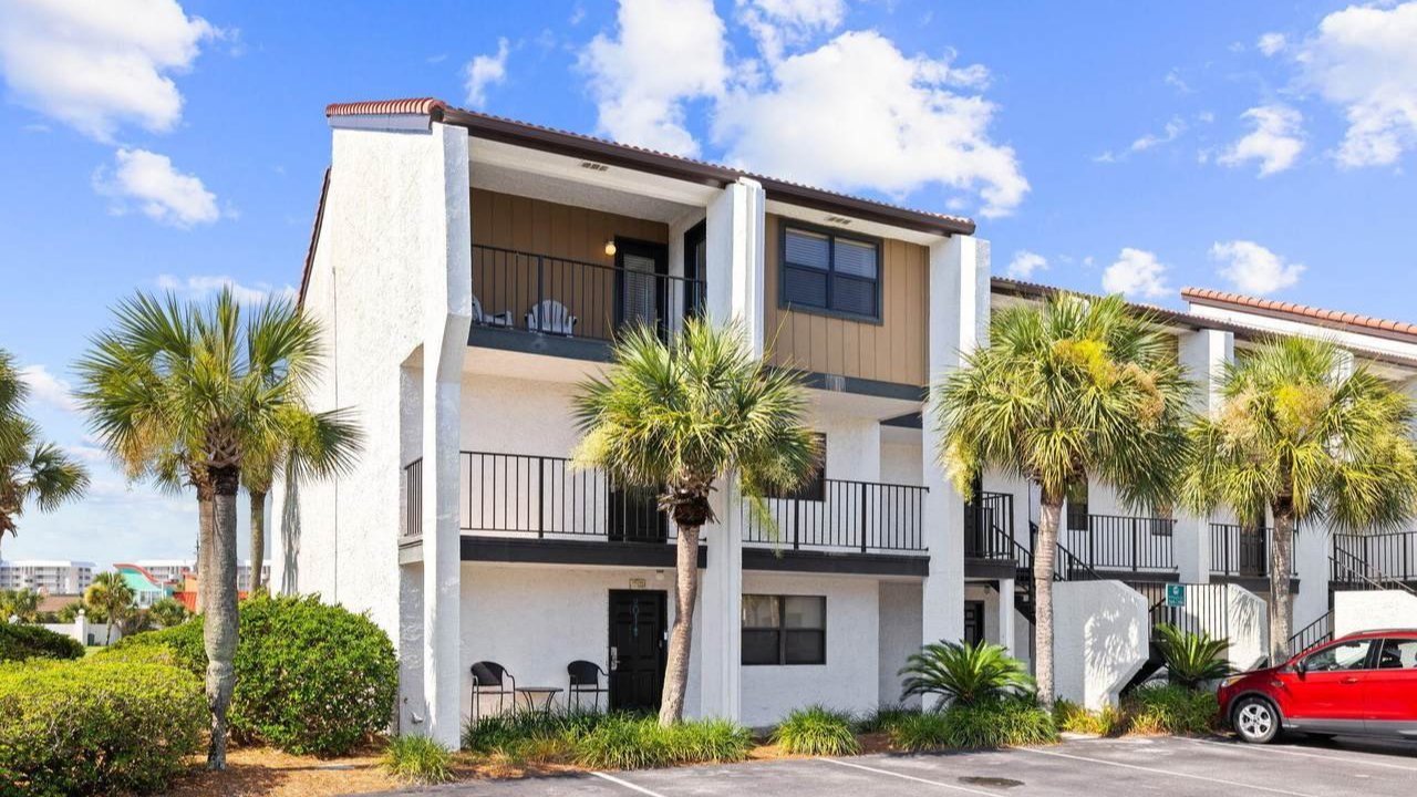 multiple edgewater homes with palm trees in the front
