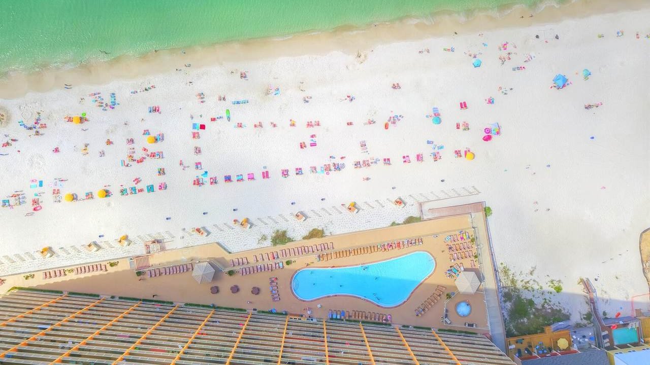 the beach surrounding treasure island condos for sale
