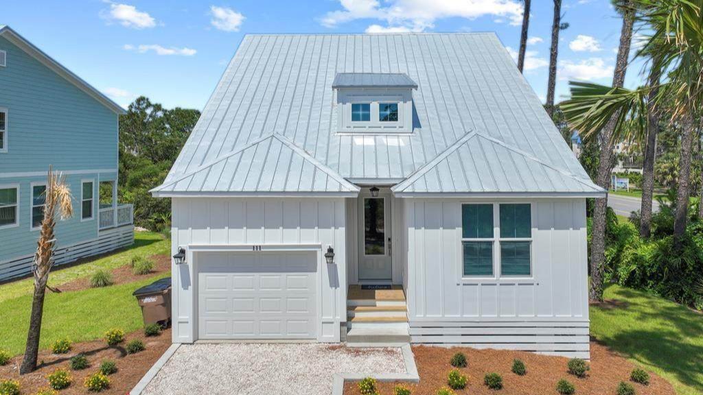 small compact blue one story cape san blas home