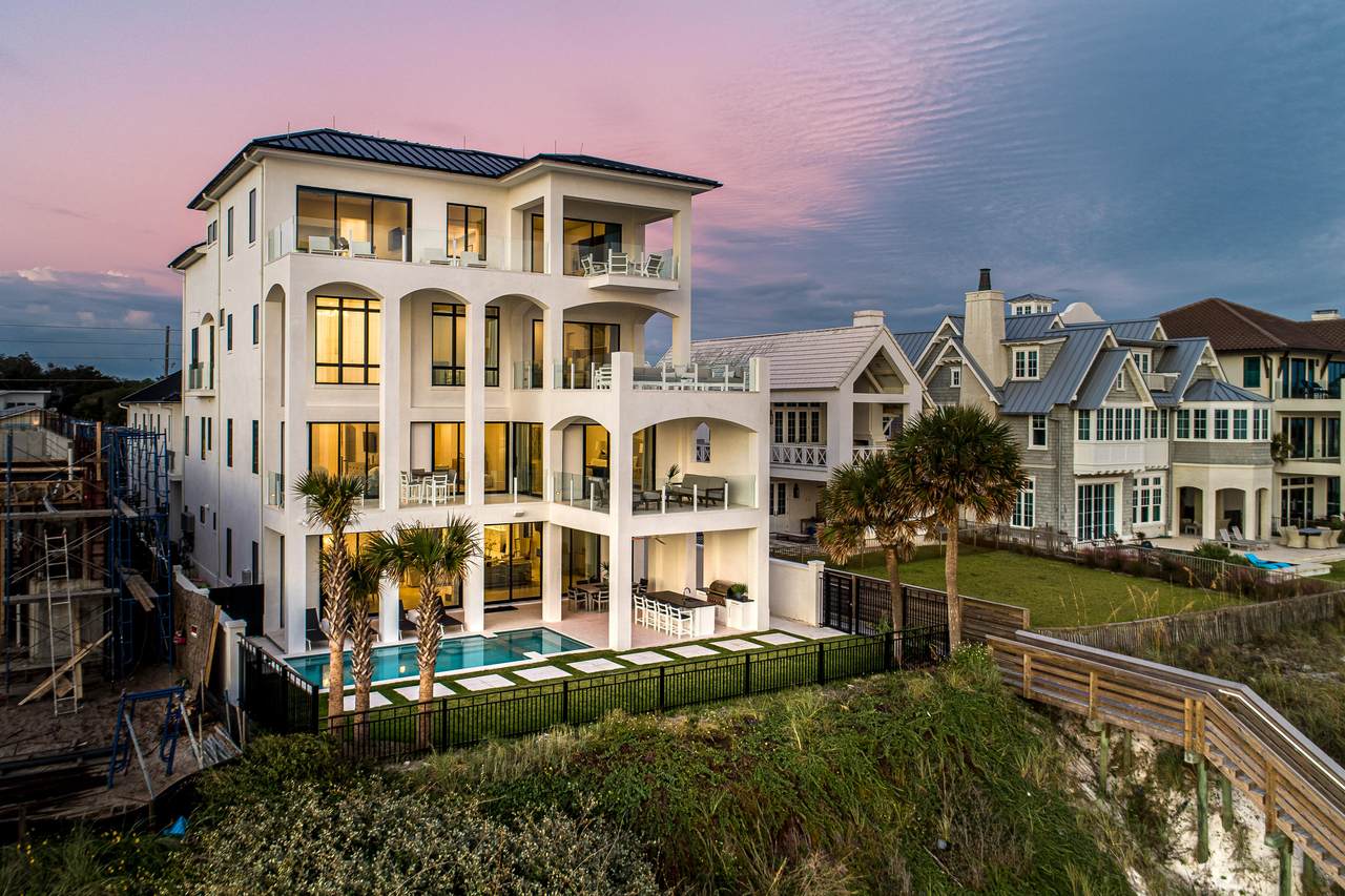 massive 30a home with a pool in the backyard