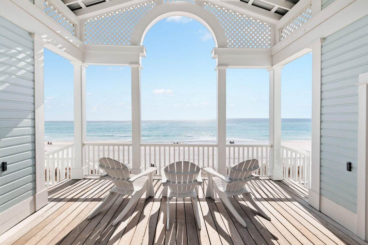 outside sitting area of a rosemary beach home with a direct view of the beach