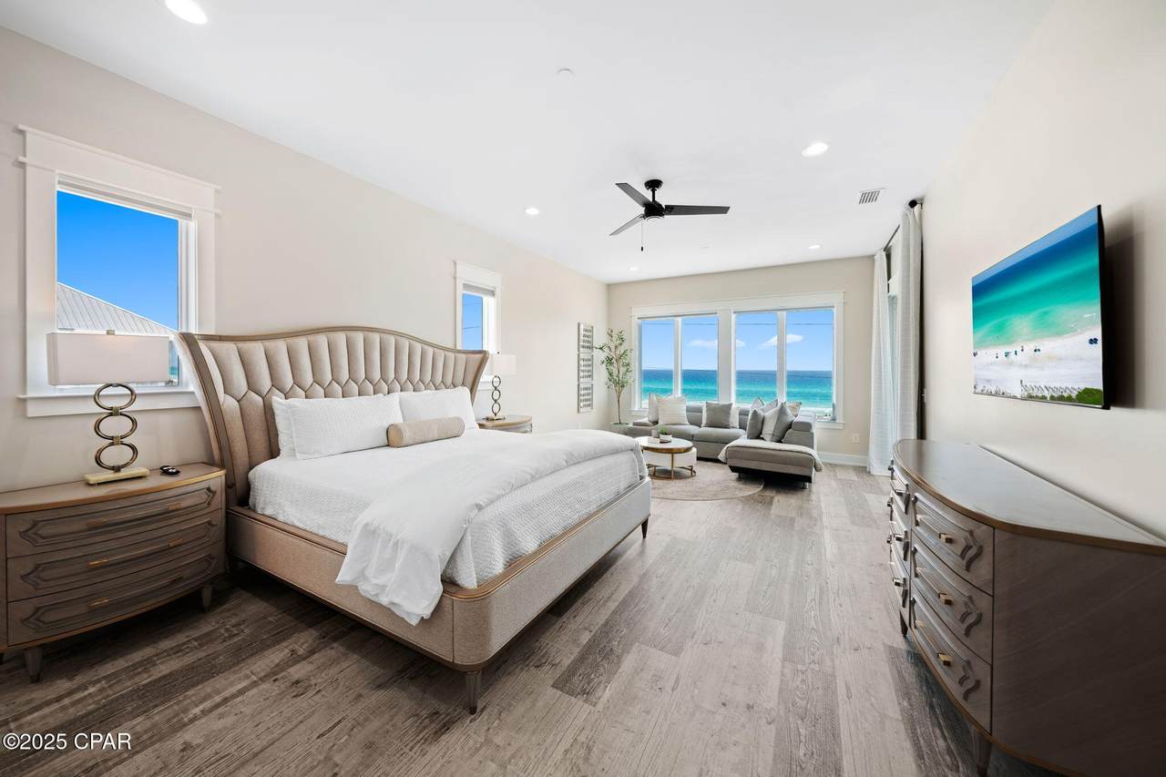 pier park home bedroom with a window expressing the vibrant blue of the sky
