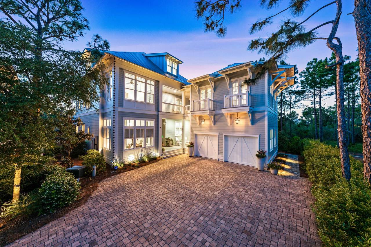 large watercolor home with two garages