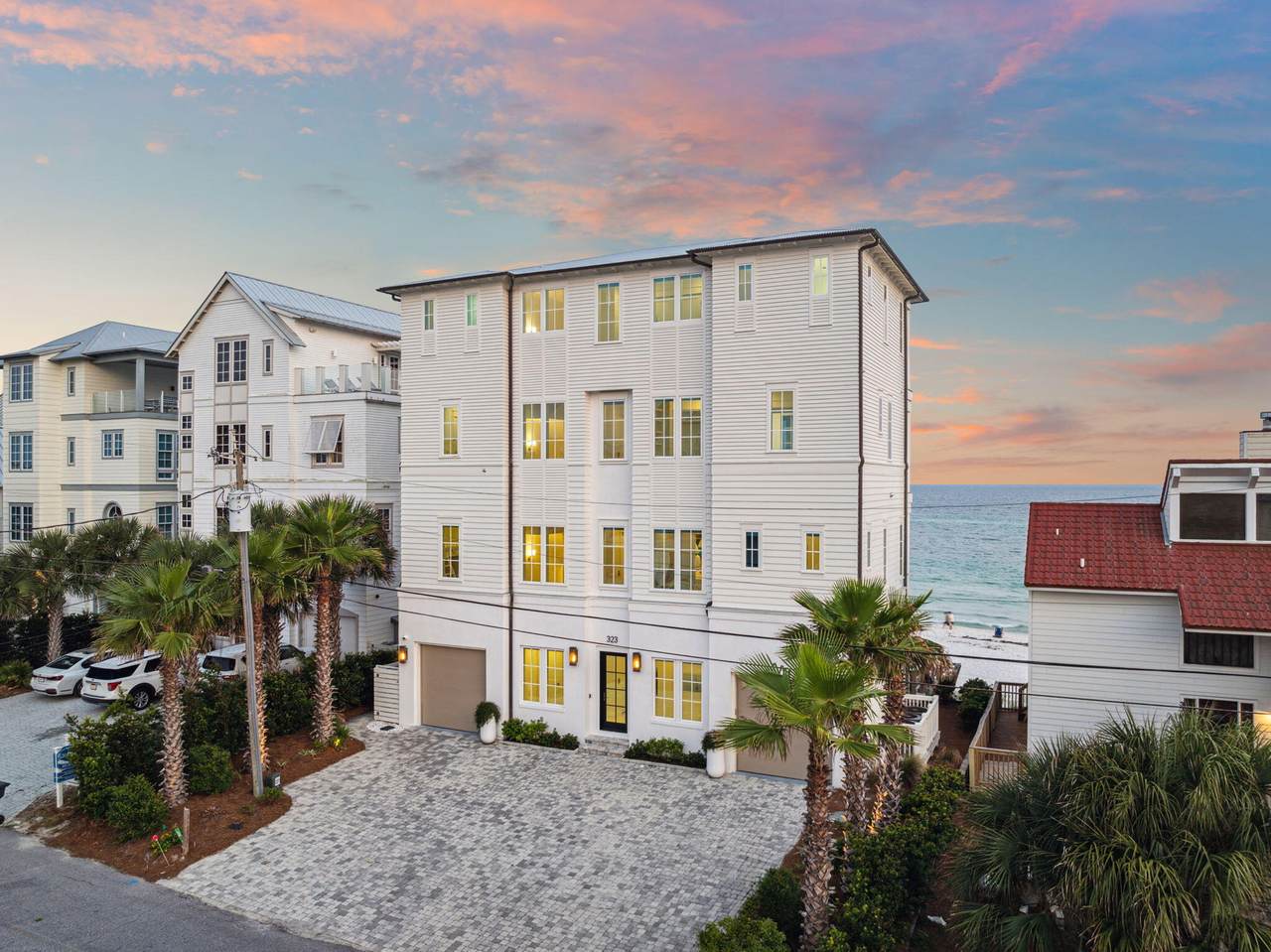 An inlet beach home with a sunset shown behind it An inlet beach home with a sunset shown behind it