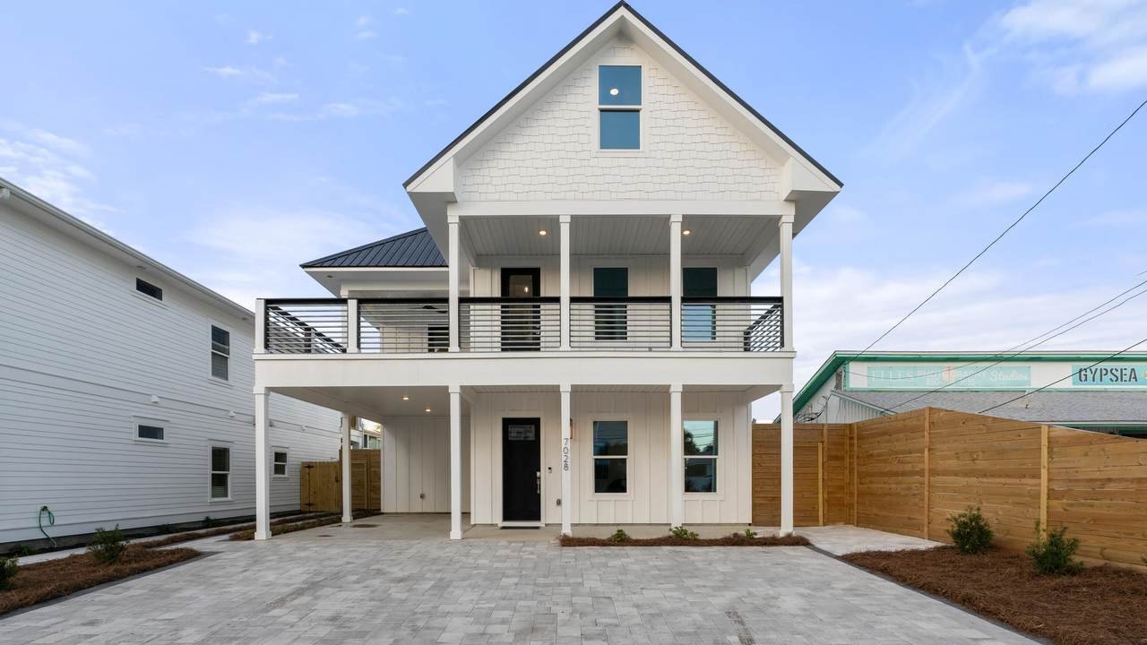 triple story holiday beach home with a balcony