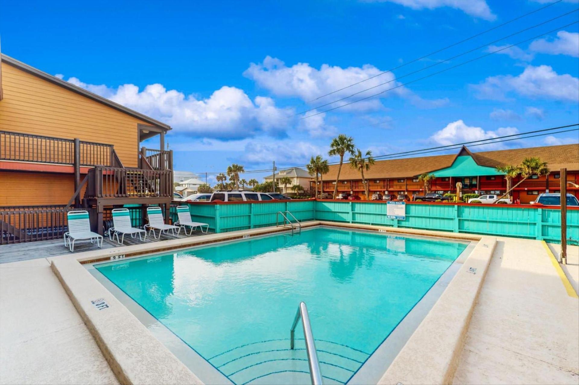 view of the crystal clear pool that occupies the polynesian condos