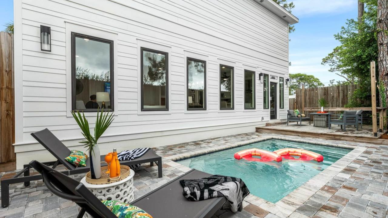 laguna beach home with a small pool in the back