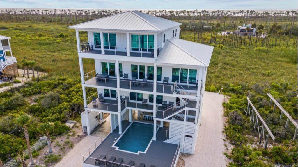 massive stilt triple story cape san blas home with a half sheltered pool