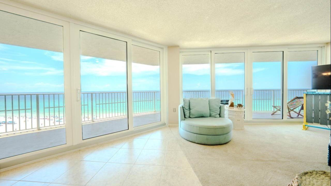 luxurious and open living room in the dunes of panama condo with a direct view of the gulf from the windows luxurious and open living room in the dunes of panama condo with a direct view of the gulf from the windows