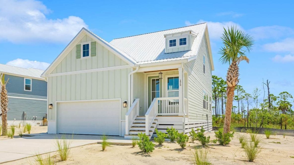 one story blue cape san blas with a garage