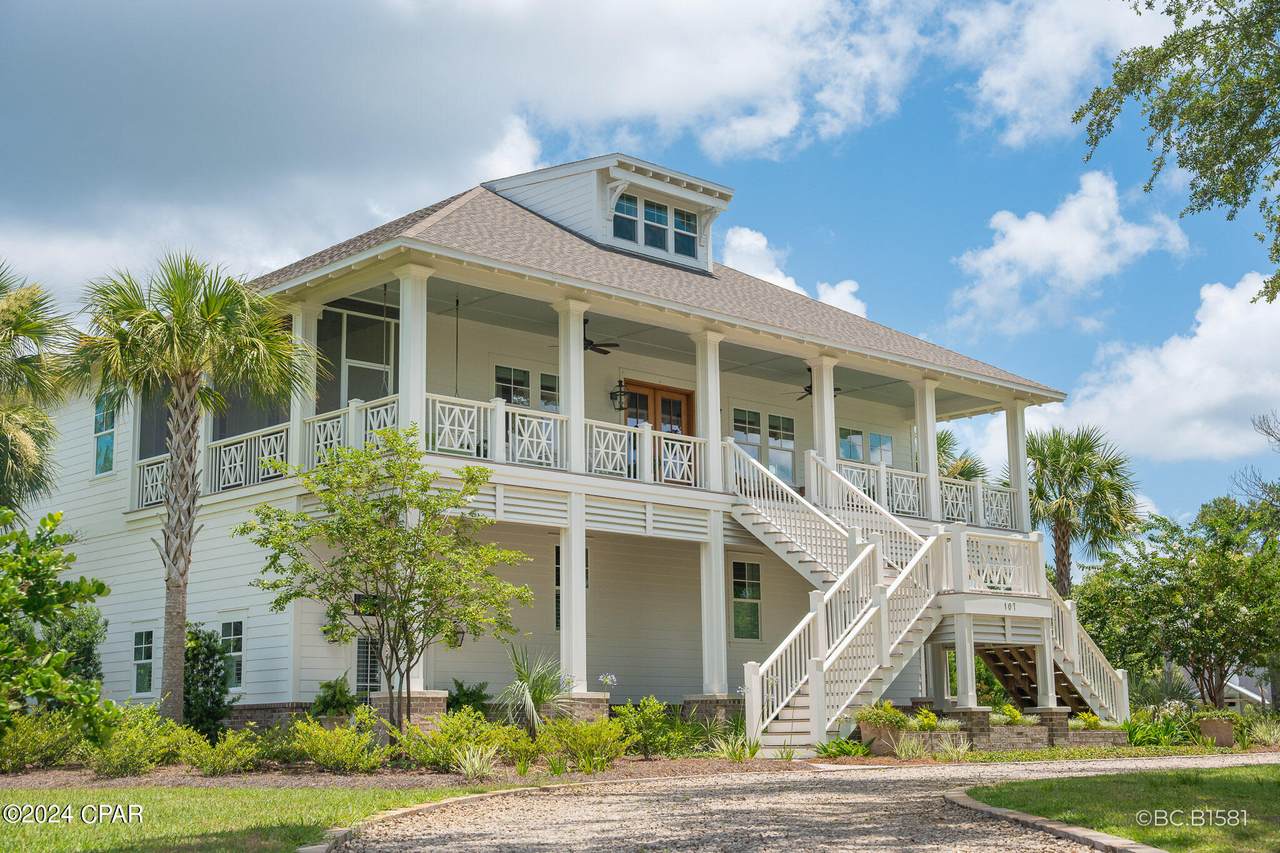 large port st. joe home with two staircases leading to its front door large port st. joe home with two staircases leading to its front door
