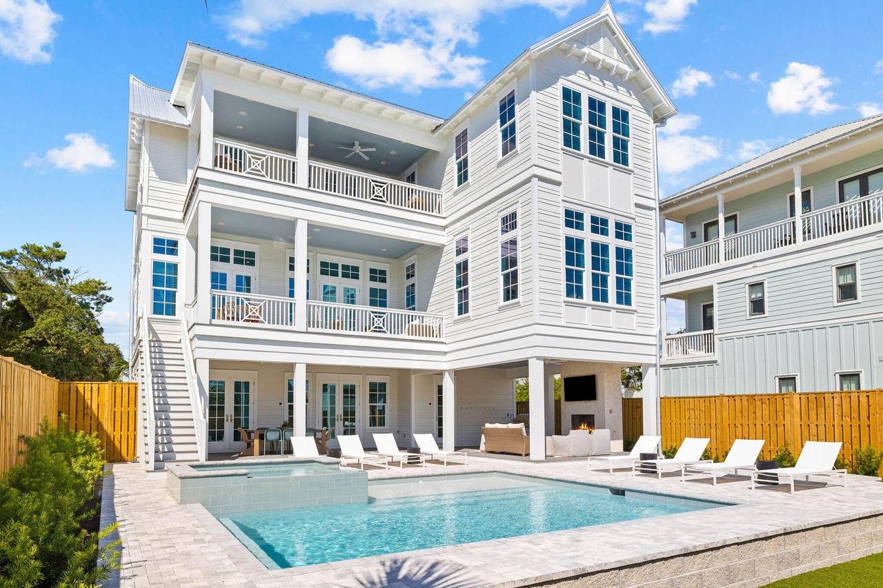 large seagrove beach home occupied with a pool in the backyard