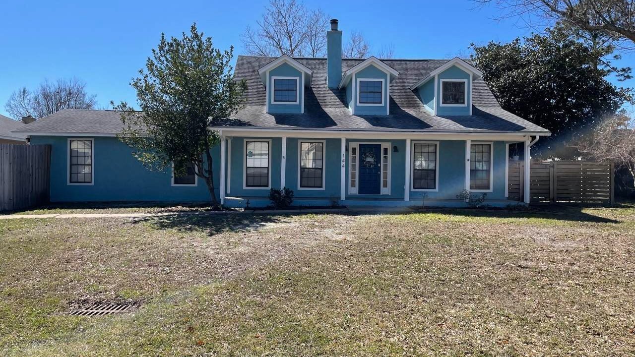 blue grand lagoon home with a large front yard blue grand lagoon home with a large front yard