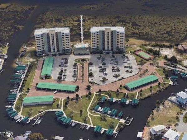 aerial view of the hibiscus by the bay condos and its parking lot aerial view of the hibiscus by the bay condos and its parking lot