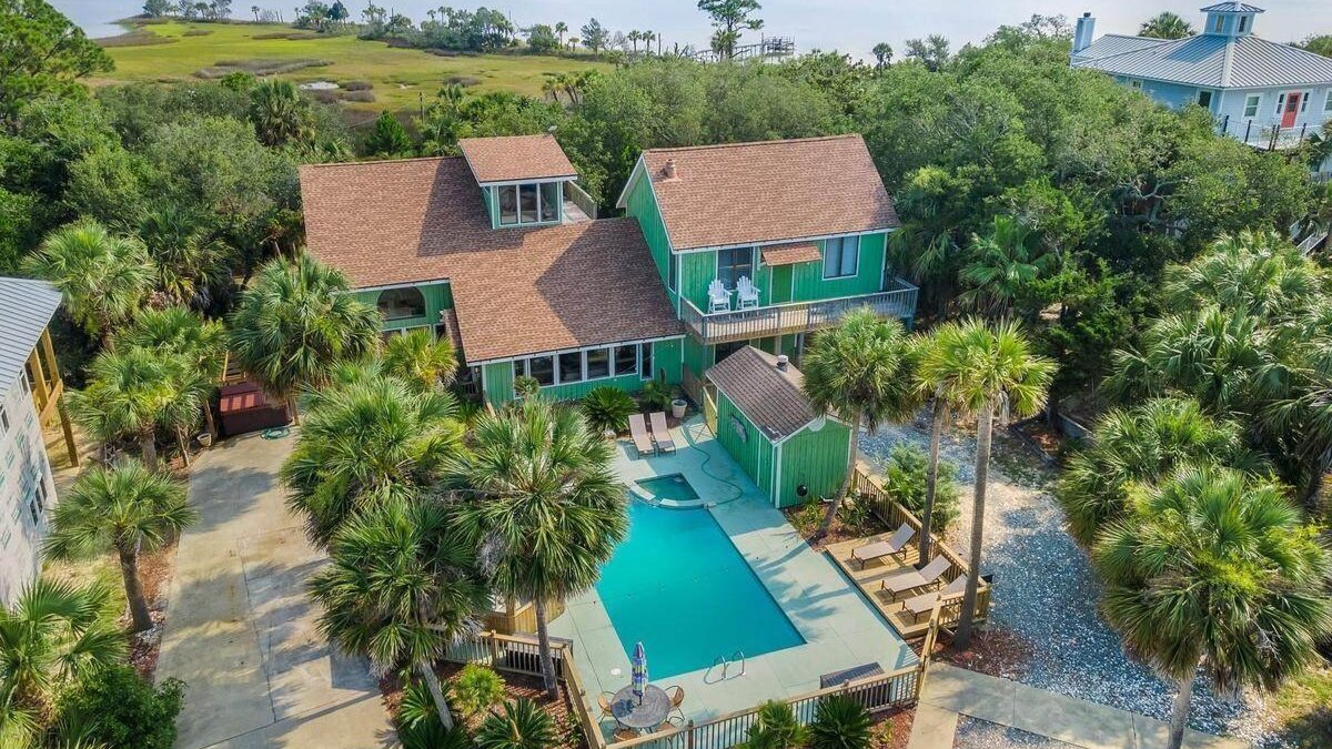 large port st. joe home with a pool in the backyard