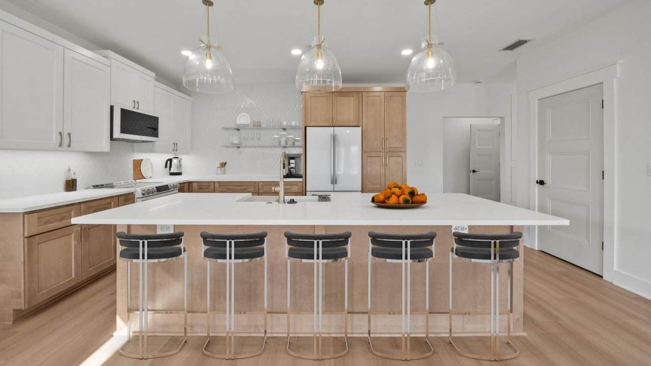 a kitchen with an island in a holiday beach home