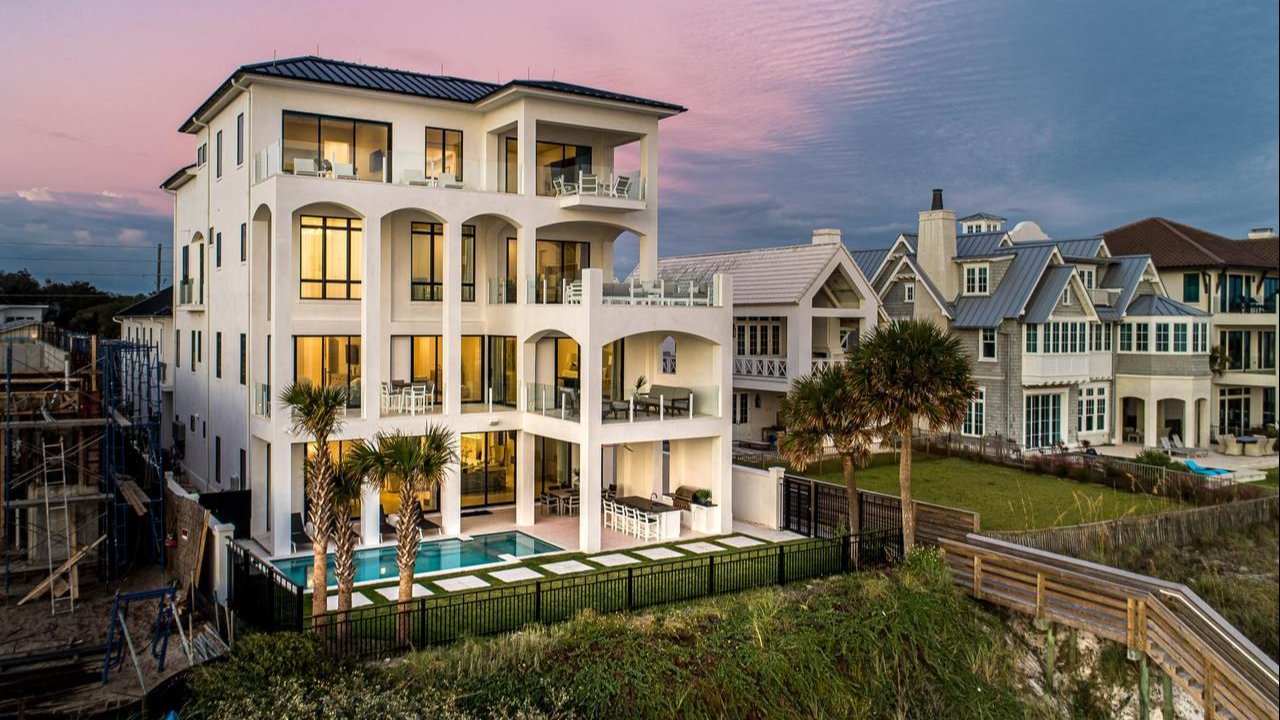 massive santa rosa beach home with a pool in the back