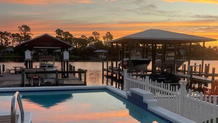 two docks with a holiday beach home pool