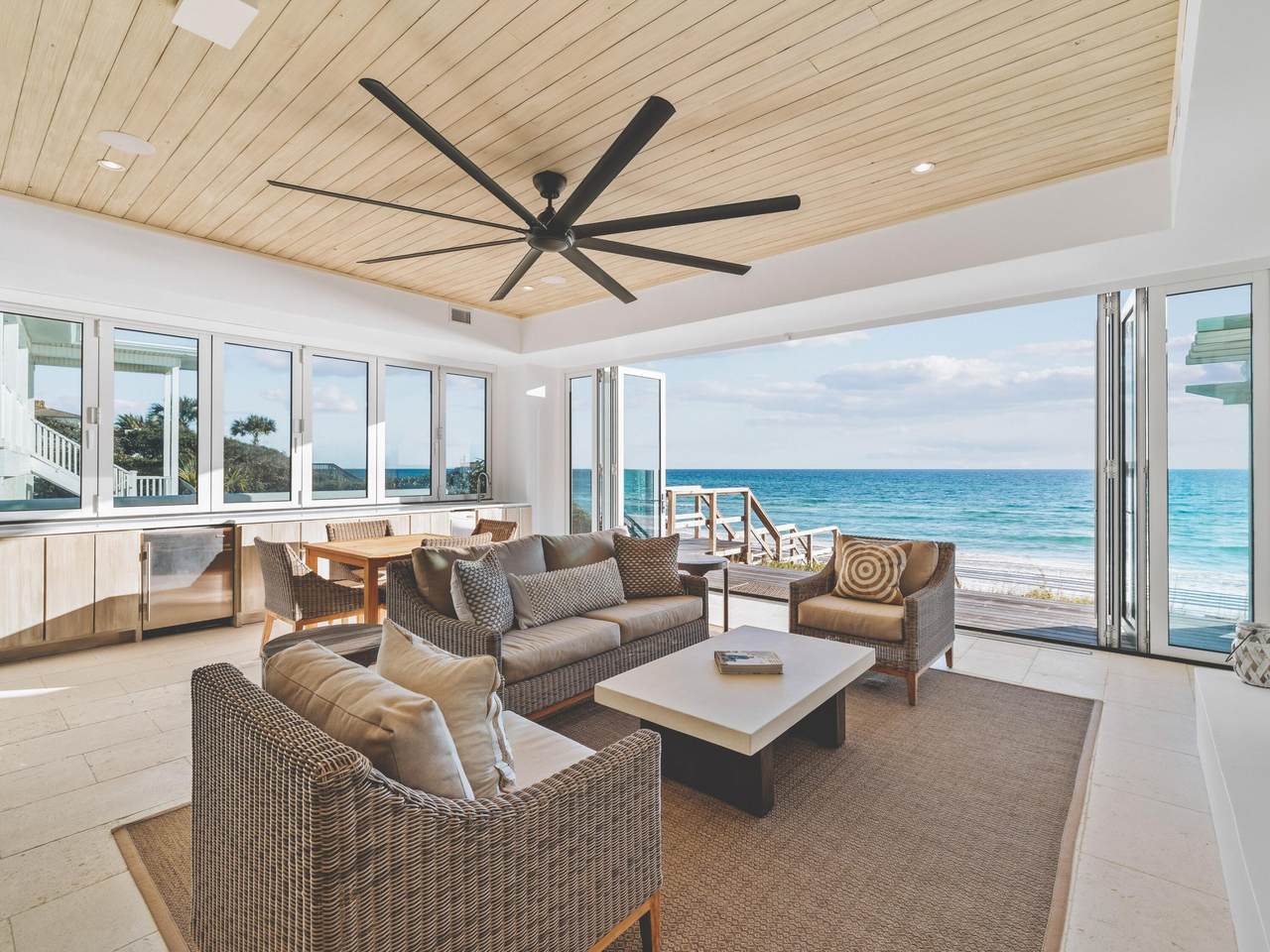 Gulf front condo with full wall windows opening to the gulf of mexico