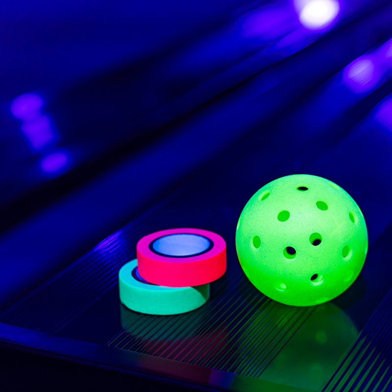 Glow in the Dark Pickleball and Tape during a Glow Event in the Alan J. Levine Athletic Facility