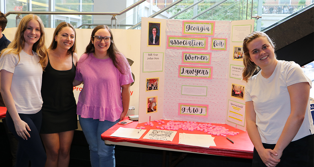 At the fall 2024 Law Student Organization Fair, Georgia Association for Women Lawyers members (l. to r.) Allison Brown, Jessie Thompson, Mary Elizabeth Entrekin and Kate Jeffries are ready to greet law school classmates wanting to learn more about the group.  