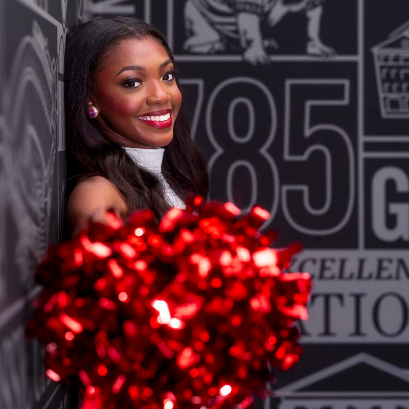 Taryn Hooks with pom poms