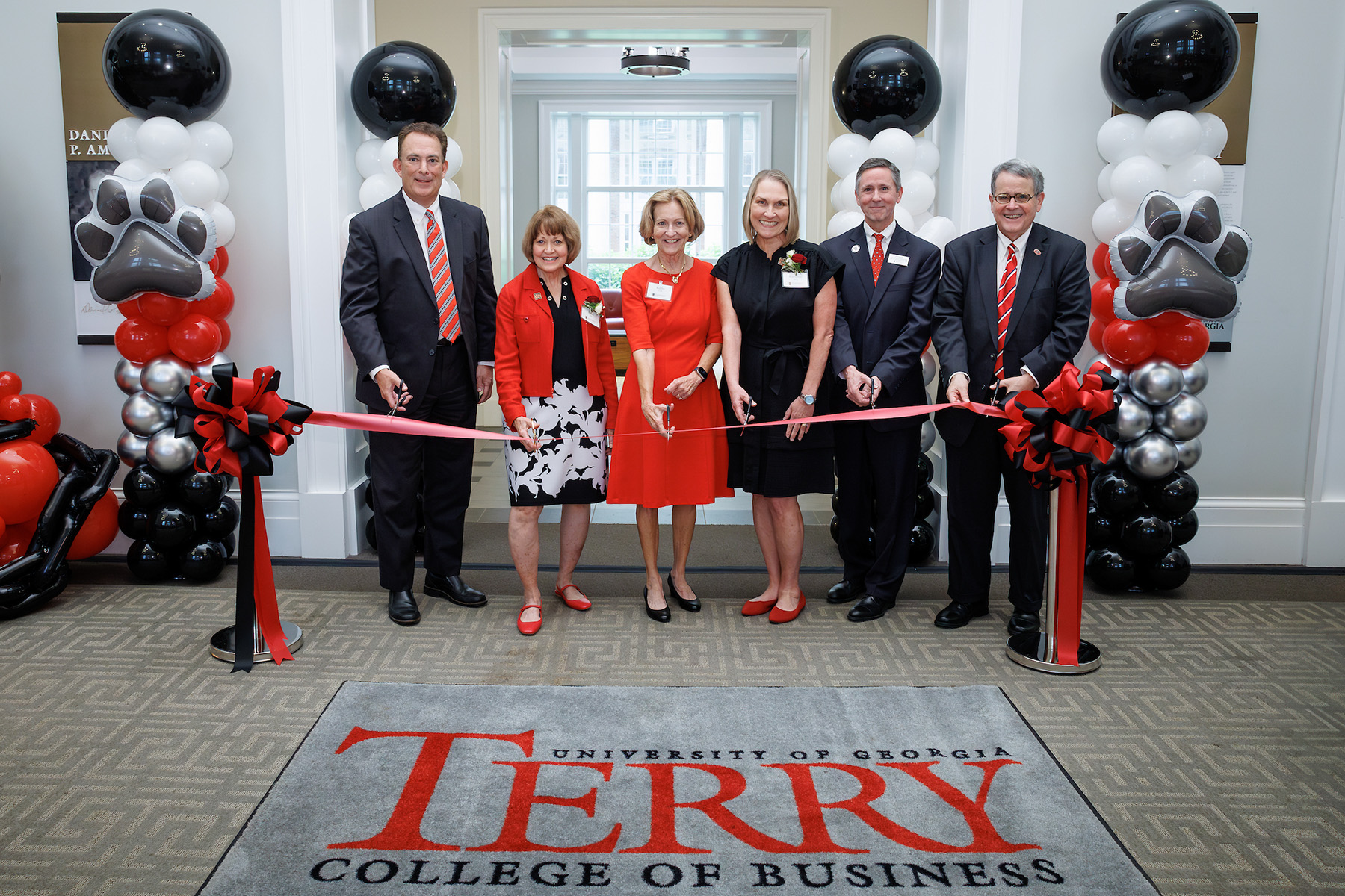 From left Terry College of Business Dean Ben Ayers, Terry Family Foundation President Betsy Cox, Terry Family Foundation Trustee Kathleen Cold, Executive Vice President Kathleen Shaw, Director of the Risk Management and Insurance program Dr. Jim Carson and University of Georgia President Jere. W. Morehead gather to cut the ribbon dedicating The C. Herman Terry Risk Management and Insurance Program in Casey Commons on Thursday, April 24, 2025 in Athens, Ga.