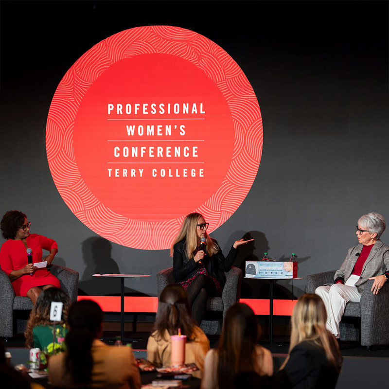 MC Lori Wilson interviews two female entrepreneurs at the Terry College Professional Conference 
