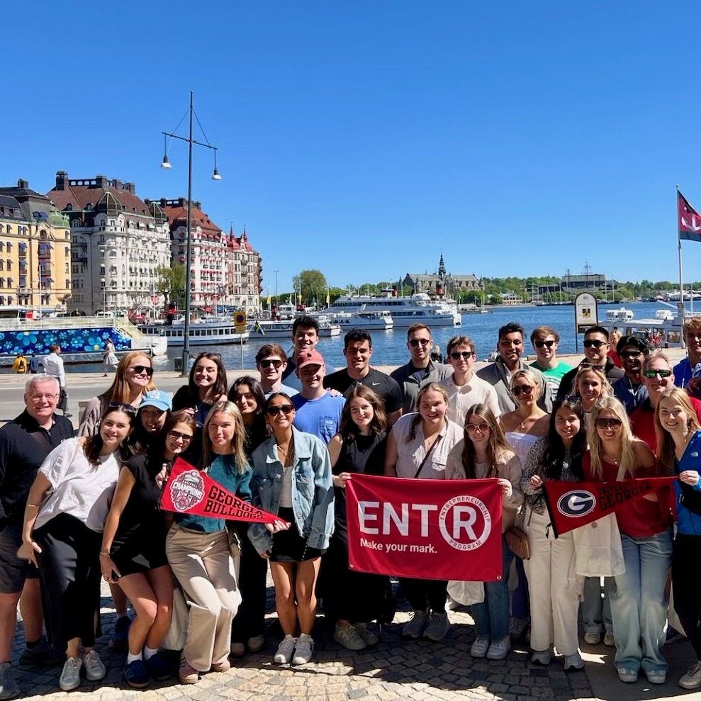 Students standing in front of a bay in Denmark