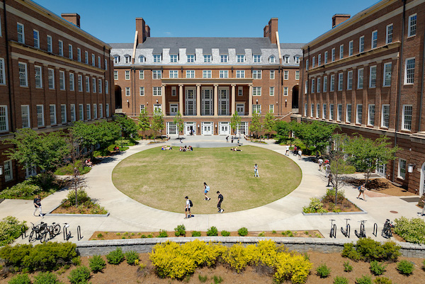 An August  photo of students on Coca-Cola Plaza in front of Terry College's Business Learning Community