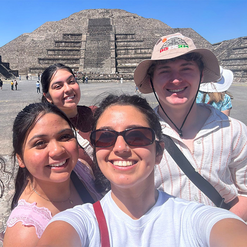 Ariana Gonzalez and friends pose in front of pyramids in Mexico