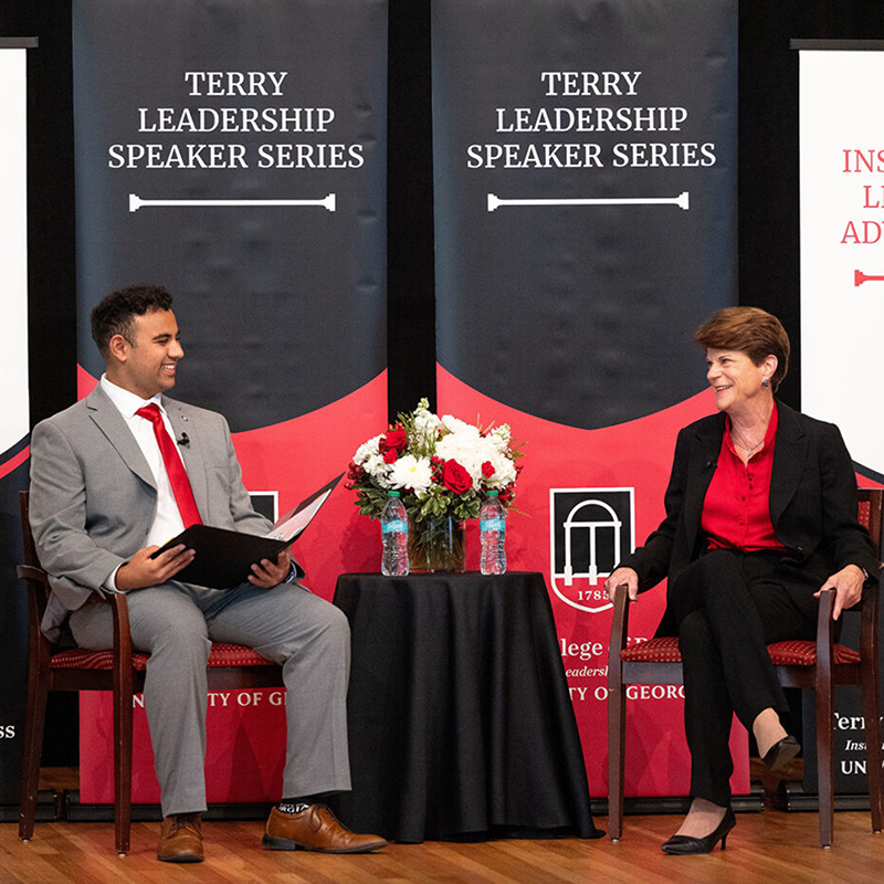 Student interviews Pam Rogers on stage at the UGA Chapel